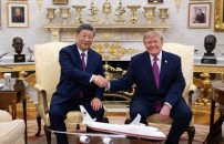 TRUMP-XI, TANTI SORRISI <BR> E NODI NON SCIOLTI