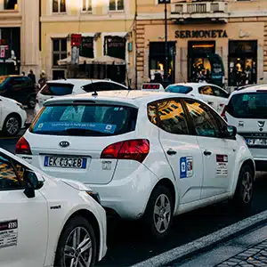 Antitrust probes shake taxi sector: Rome, Milan, and Naples under scrutiny.